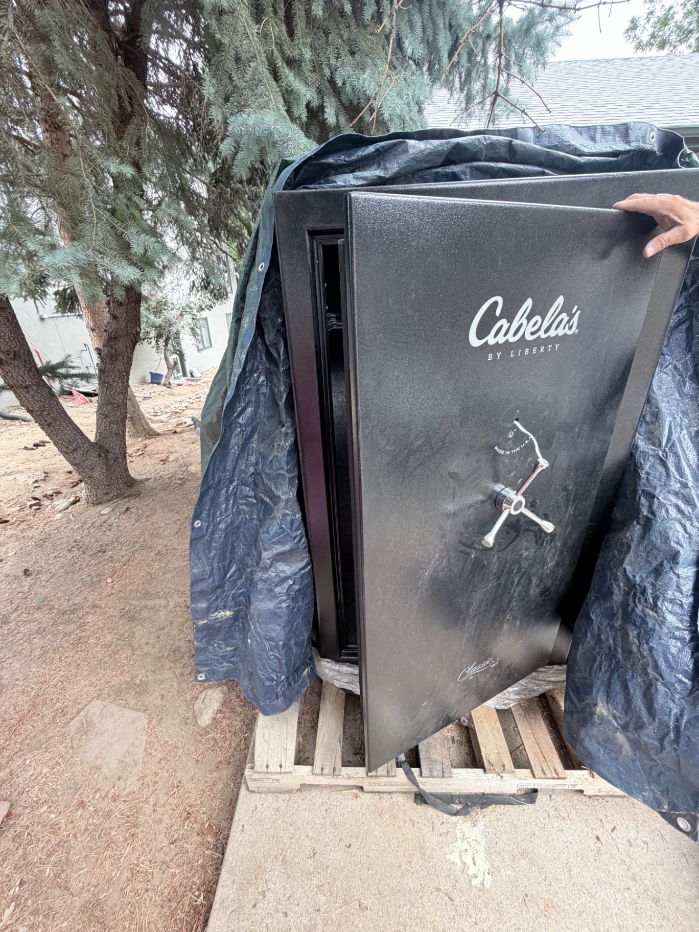 Locksmith opening a Cabela's by Liberty gun safe during a safe lockout in Englewood, Colorado