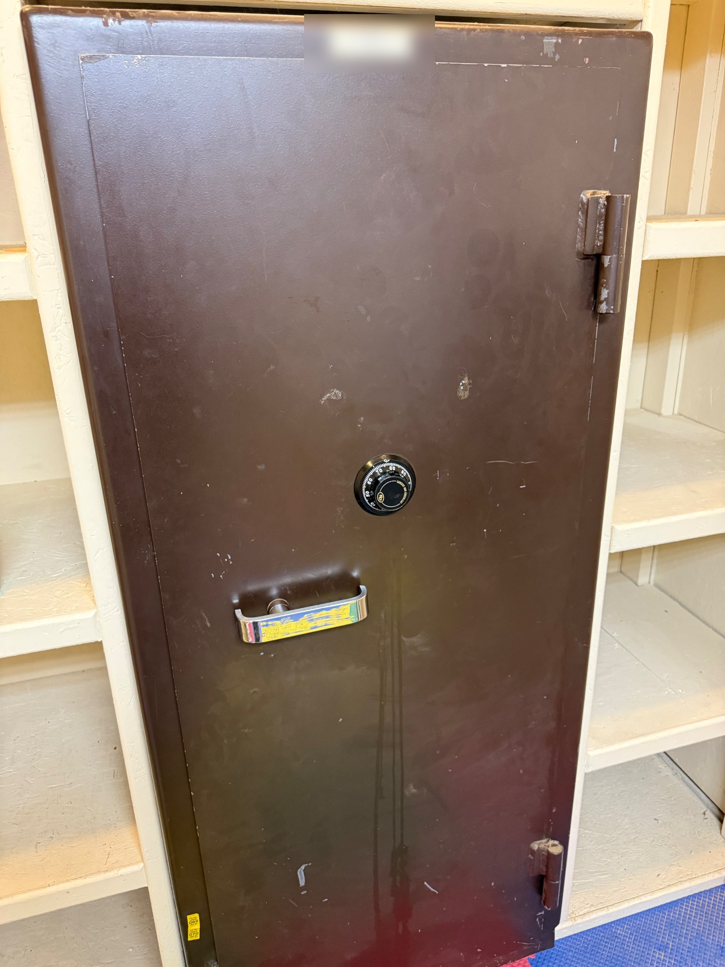 Brown commercial floor safe with a combination dial before a safe lockout service in Elizabeth, Colorado