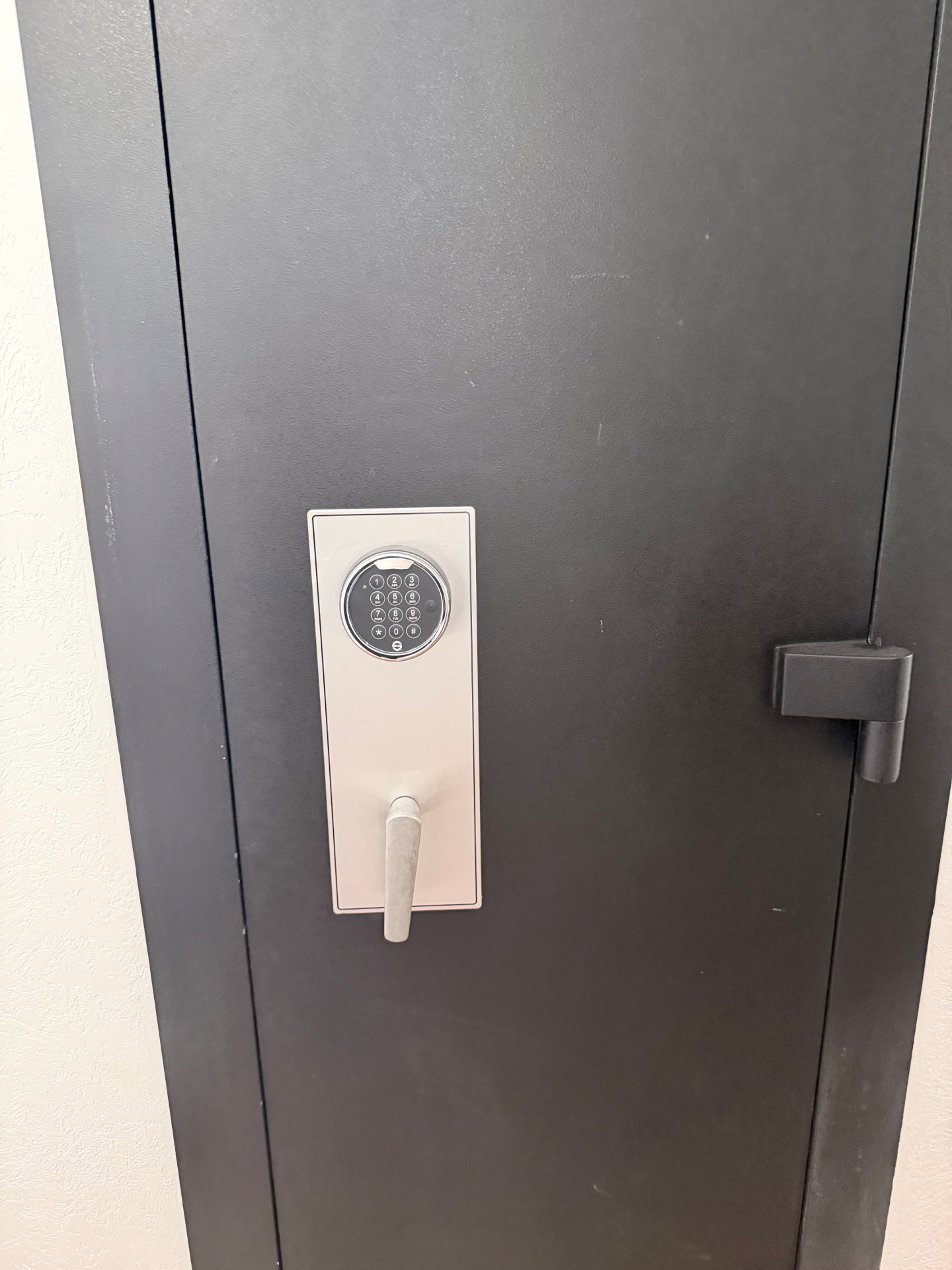 New electronic keypad lock installed on the same black gun safe after the safe lock change in Arvada, Colorado