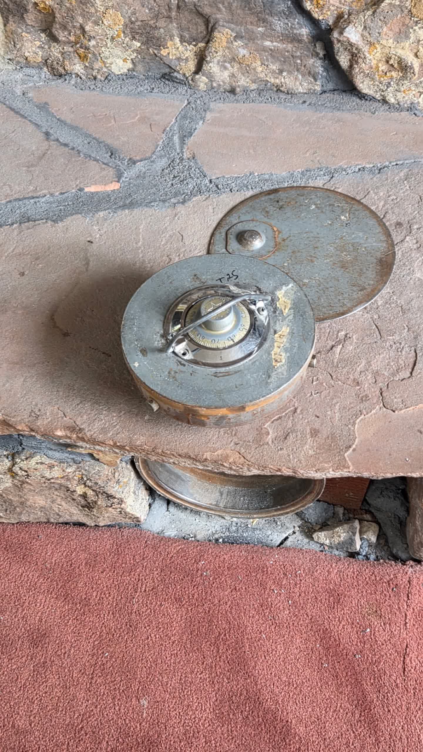 Open floor safe door with mechanical combination dial exposed during a combination change in Aurora, Colorado