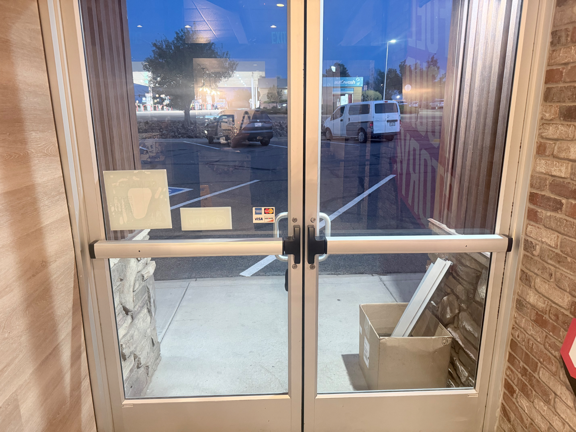 Commercial double glass doors with newly replaced push bars in Highlands Ranch Colorado