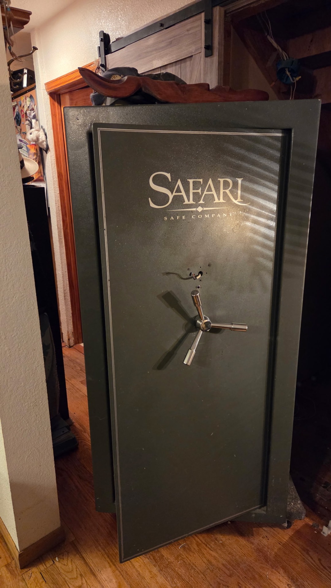 Green Safari gun safe with its door open after a professional safe lockout service in Denver, Colorado