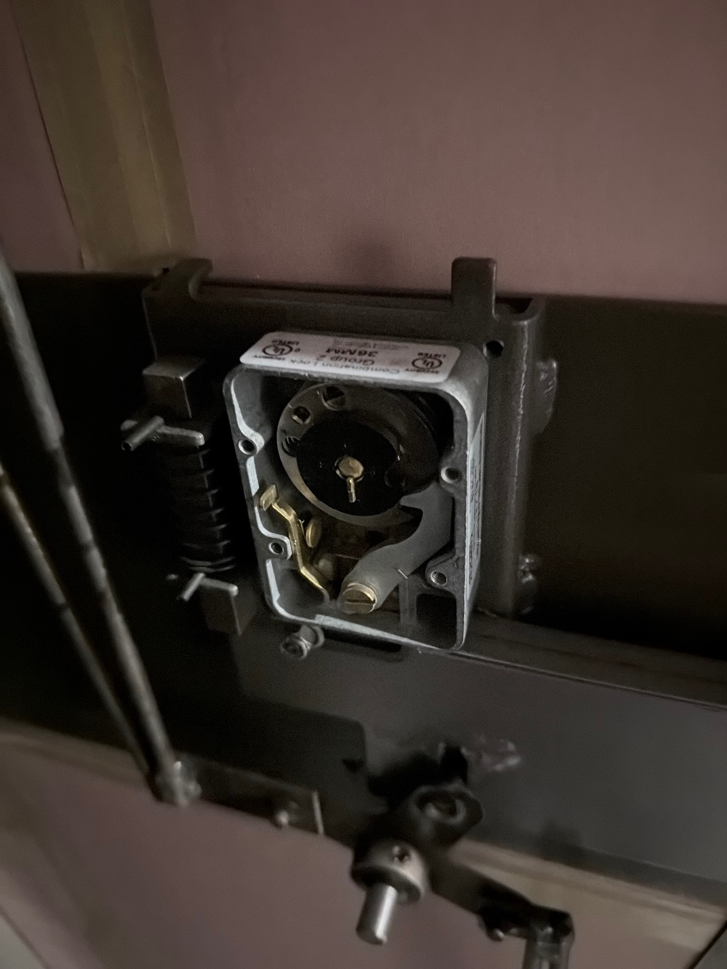 Mechanical Group 2 combination lock exposed on the inside of a residential safe door during a combination change in Denver, Colorado