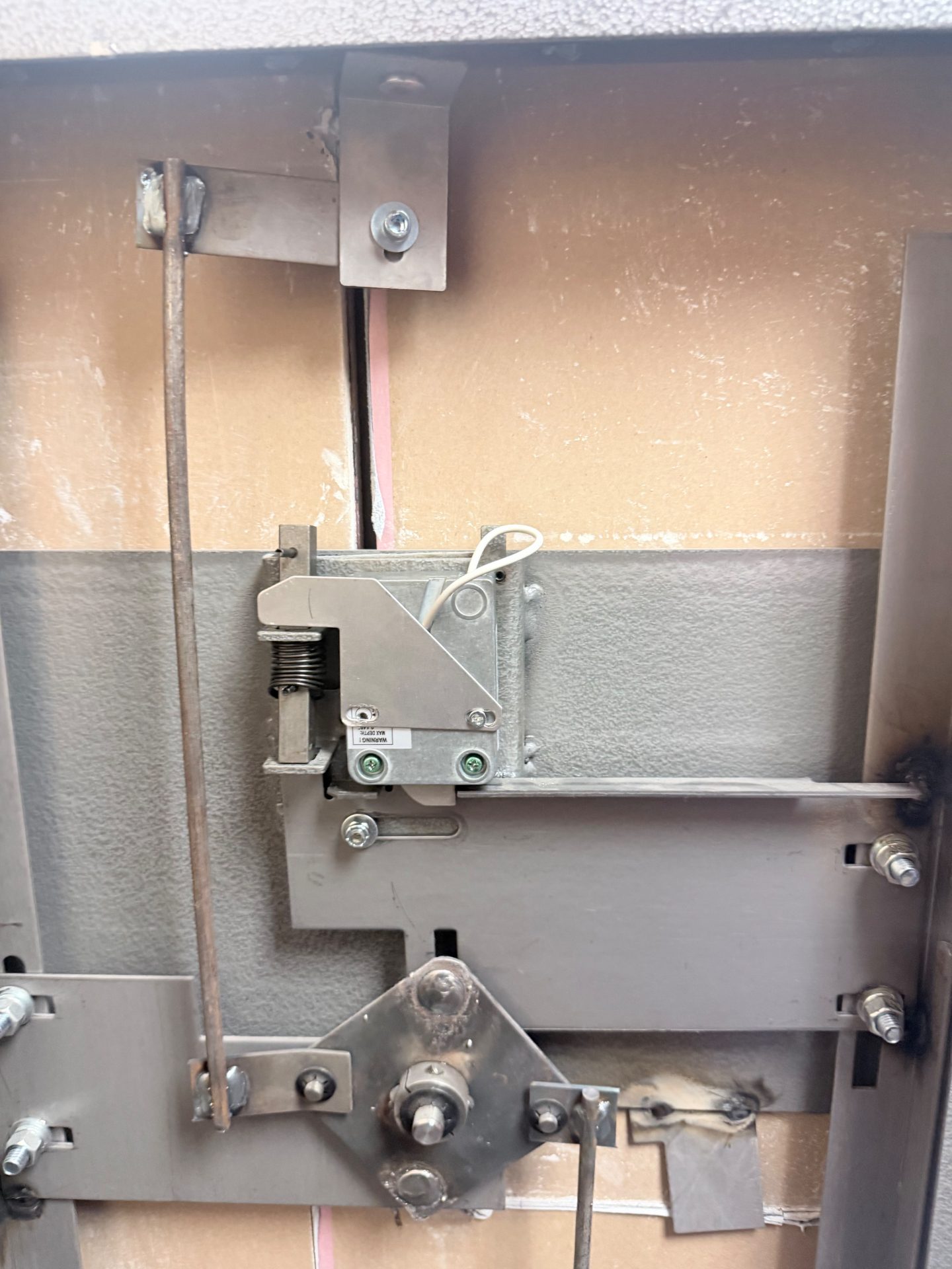 Interior of the Winchester gun safe door showing the replacement electronic lock body and bolt work in Morrison, Colorado