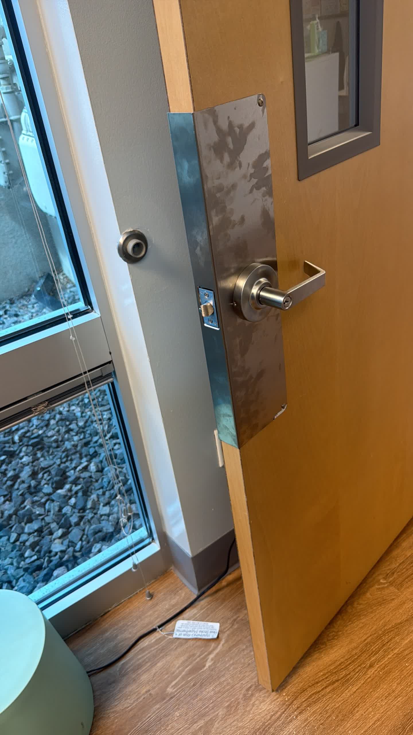 Edge view of the office door showing the new keypad lock latch and interior lever in Westminster, Colorado
